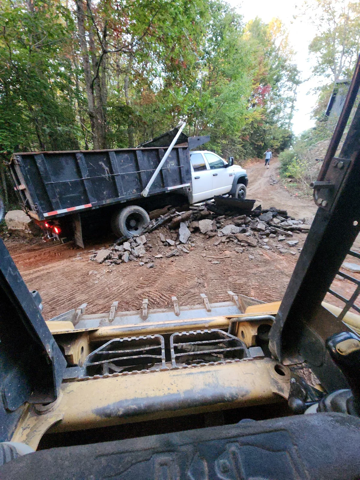Loading the dump truck with rock off a cut
